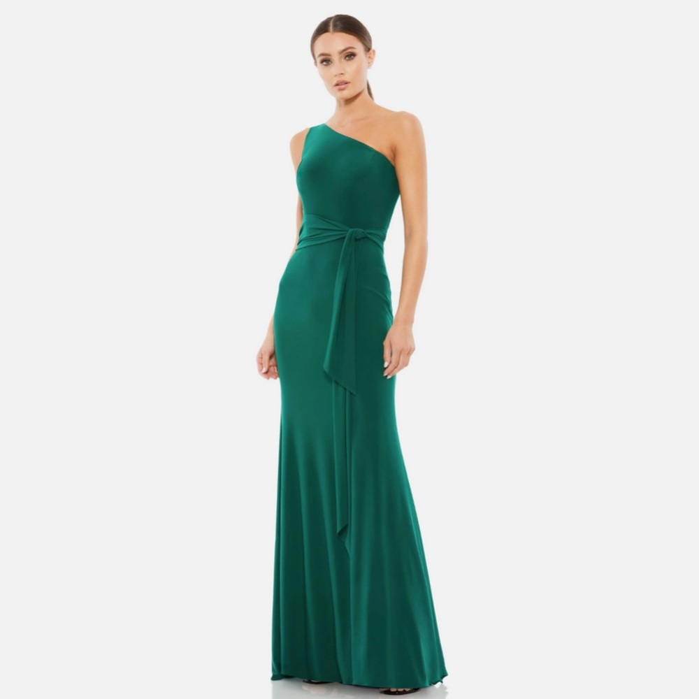 JERSEY ONE SHOULDER BELTED TRUMPET GOWN